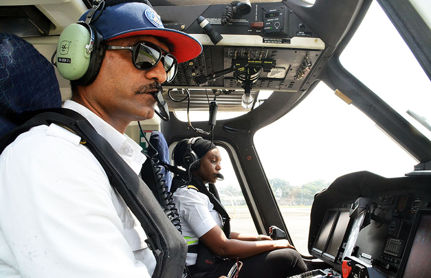 Man and a woman in a training session in a helicopter of Caverton Helicopters in Nigeria (photo)