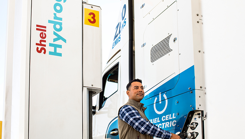 Man filling up  a truck with hydrogen at a Shell hydrogen station (photo)