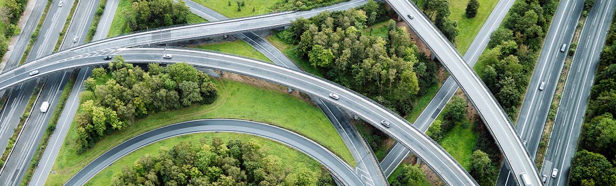 Aerial view of motorway junctions, trees and fields (photo)