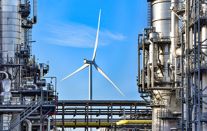 Wind turbine seen against a blue sky at Shell Chemicals Park Moerdijk (photo)