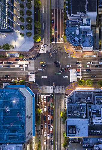 Aerial view of a city buildings and road intersection in tokyo by night
