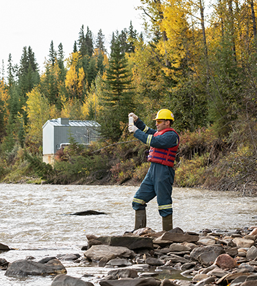 Man testing the water quality (photo)