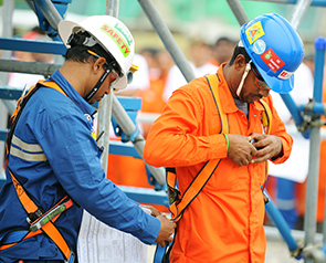 Contractors taking part in an exercise on Safety Day at Pulau Bukom manufacturing site, Singapore. (photo)