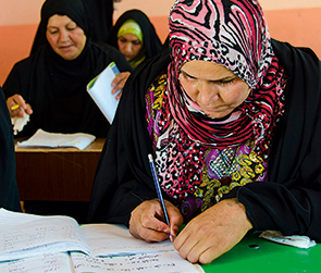 Students attend a women’s literacy class in Majnoon, Iraq (photo)