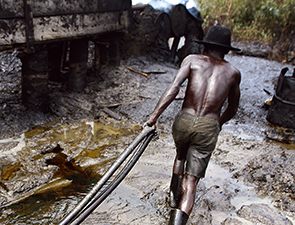 Illegal makeshift oil refineries contribute to economic loss and environmental damage in the Niger Delta, Nigeria (photo)