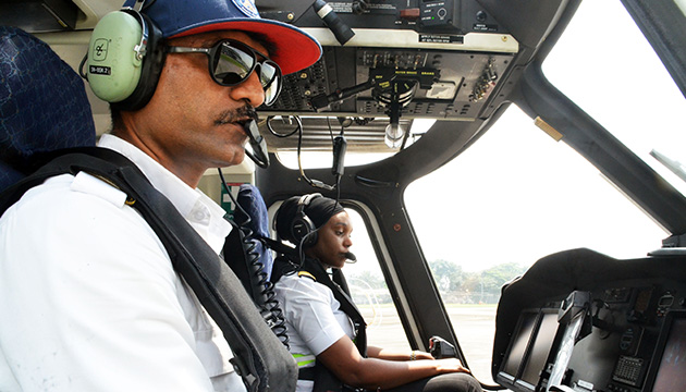 Man and a woman in a training session in a helicopter of Caverton Helicopters, Nigeria (photo)