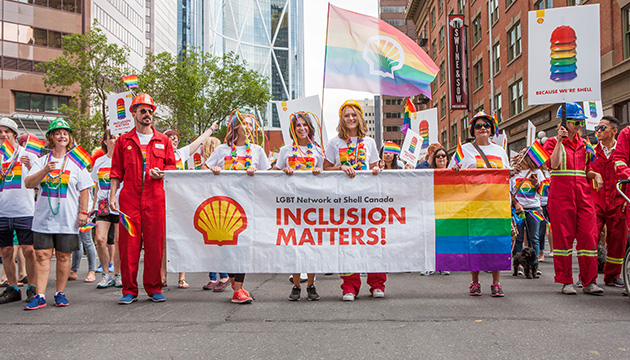 Shell employees in Canada proudly wear the rainbow colours during a march. (photo)