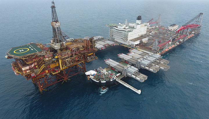 The heavy lift ship Pioneering Spirit positioning underneath the Shell Alpha platform in the North Sea, UK. (photo)