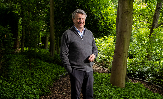 Ben Van Beurden, Chief Executive Officer of Royal Dutch Shell plc, standing outside among trees. (photo)