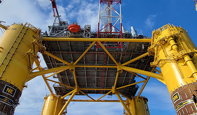 Oil platform, view from bottom to the clear sky (photo)