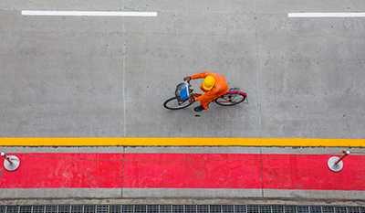 Man on a bike in Pulau Bukom, Singapore, view from top (photo)