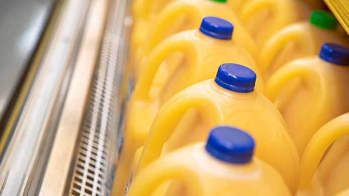 plastic juice cartons on a supermarket refridgerated shelf
