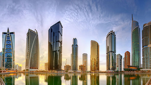 Panoramic view of Business bay and Lake Tower, reflection in a river, UAE - stock photo (photo)