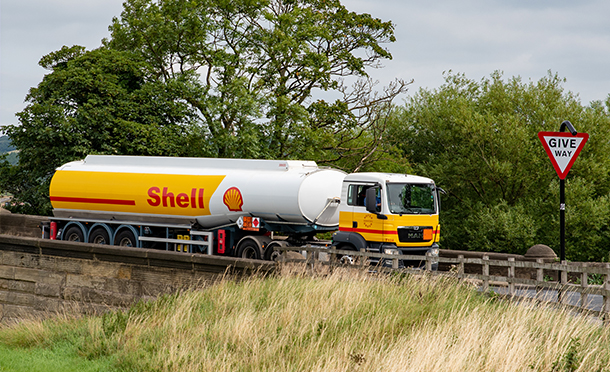 Shell tanker, driving through the countryside, on route to deliver fuel to a retail station. (photo)