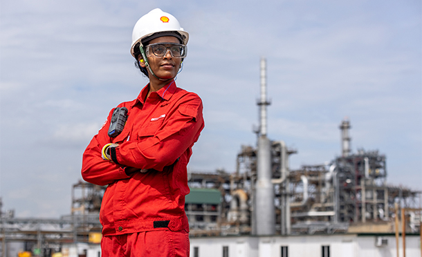 A Shell employee with a Jurong Island in the background. (photo)